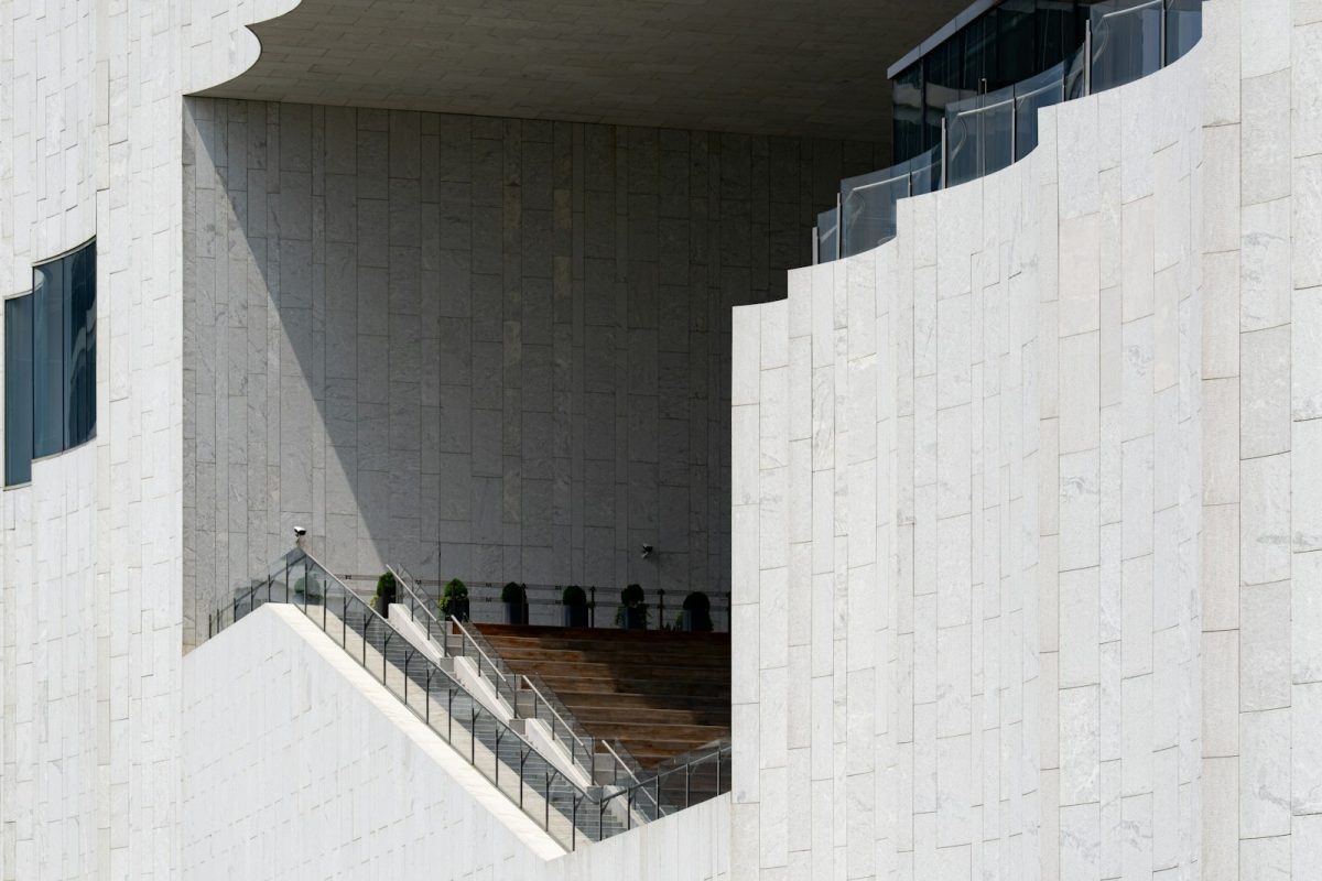 Architecture features a staircase within a carved facade.